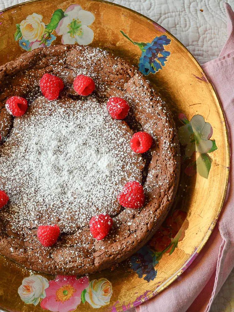 fudge raspberry torte on decoupage platter