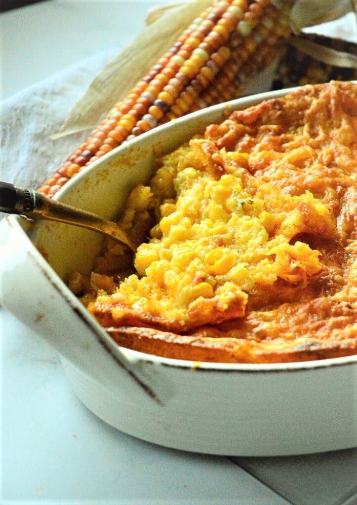 jiffy corn casserole in white oval baking dish