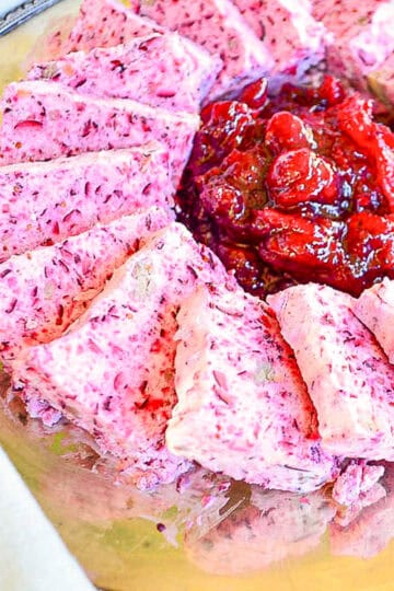 frozen cranberry salad on silver platter with jellied cranberries in middle
