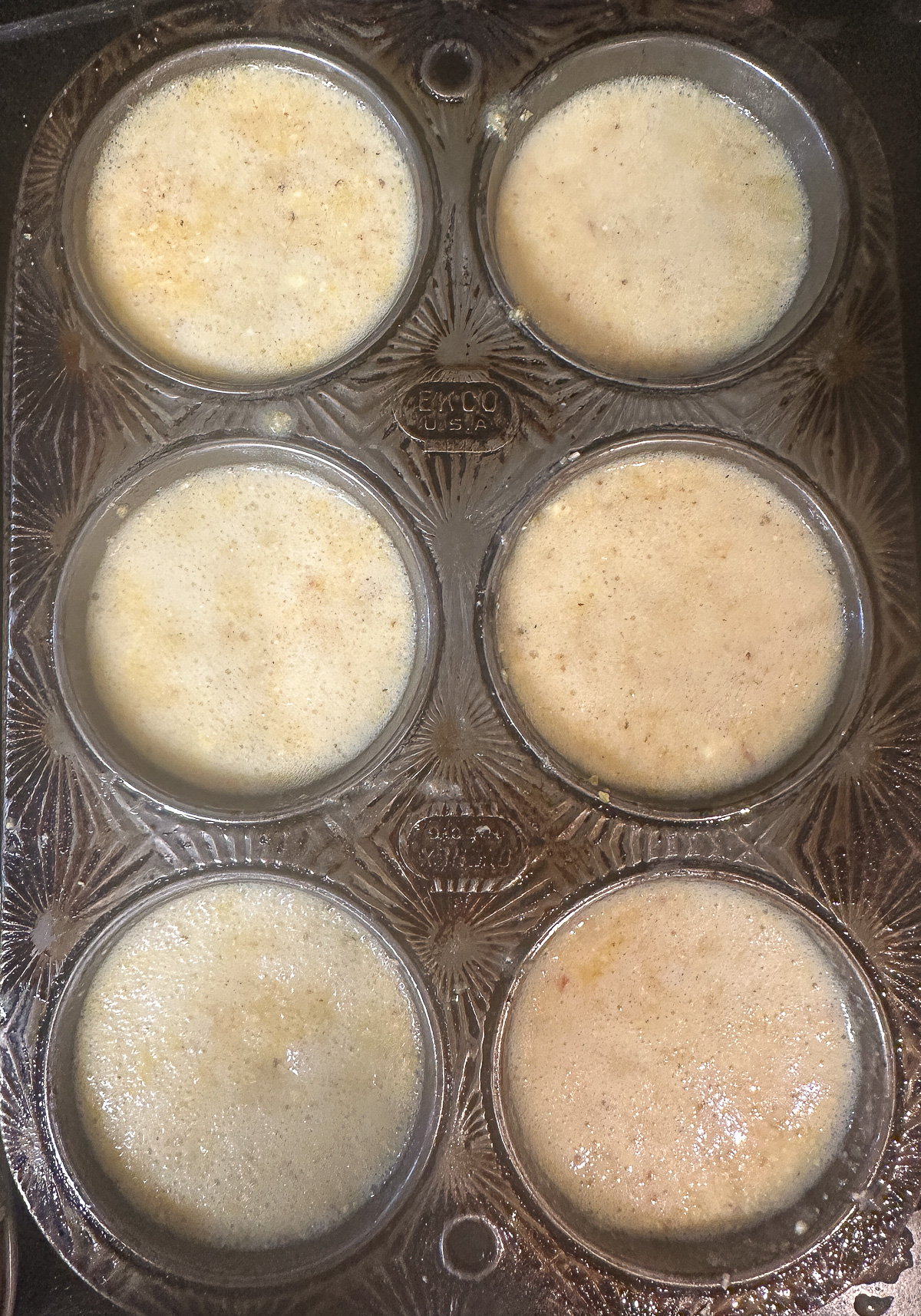 cornbread muffin batter in muffin tin