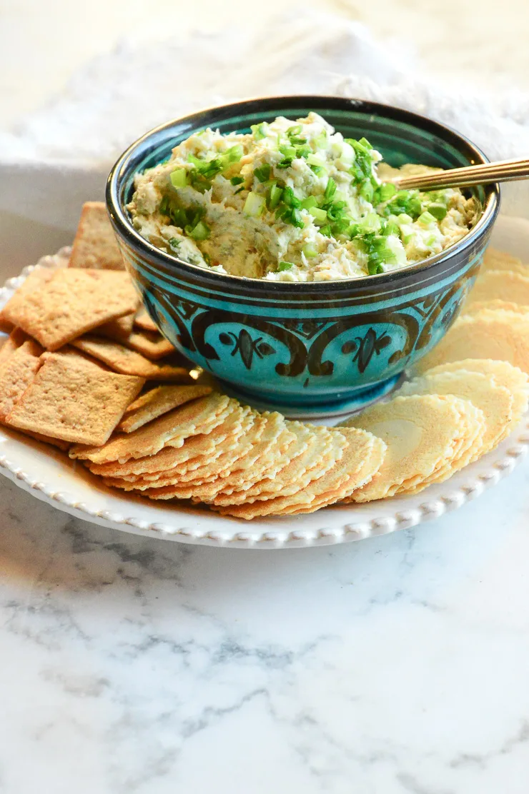 Smoked Fish Dip in blue bowl with crackers