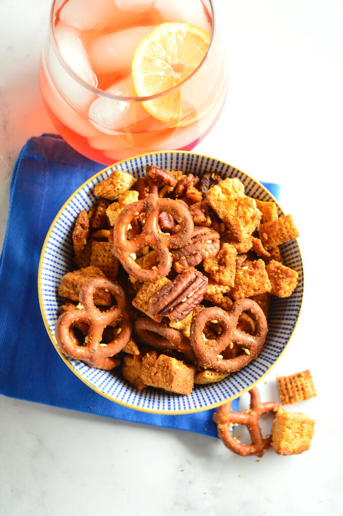 Chex Mix, blue napkin, ice tea, blue bowl