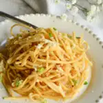 Asian Garlic Noodels/white plate/fork