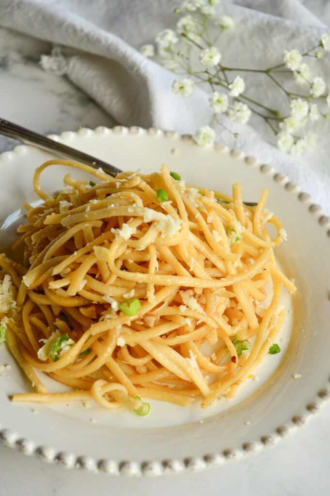 Asian Garlic Noodels/white plate/fork