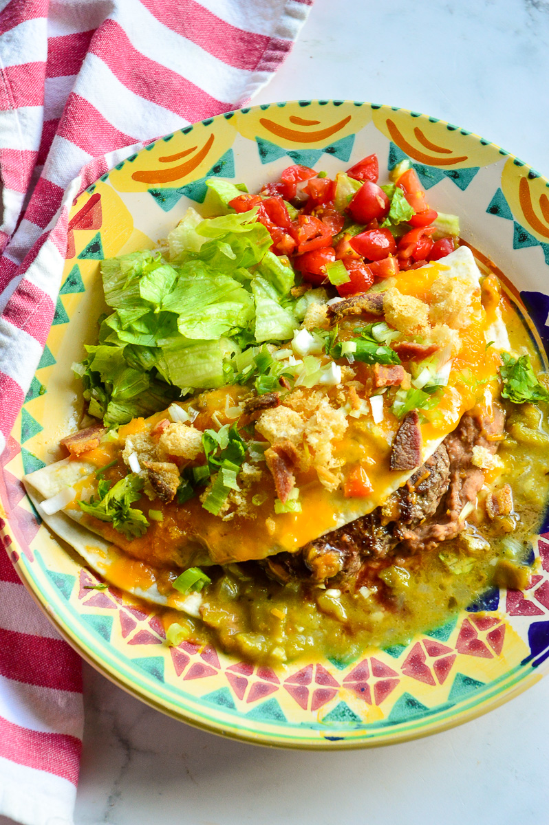 Famous Mexican burger on colorful plate with red striped napkin
