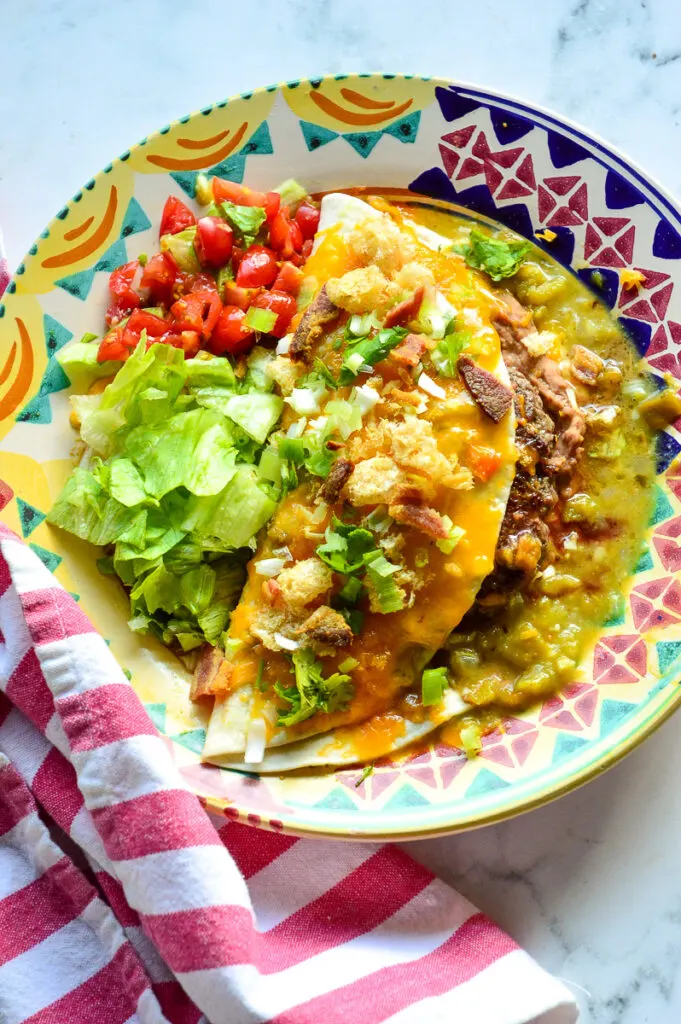 Mexican burger on colorful plte/red stripe napkin