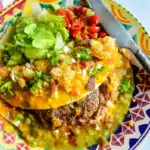 Mexican hampburger in tortilla with green chile