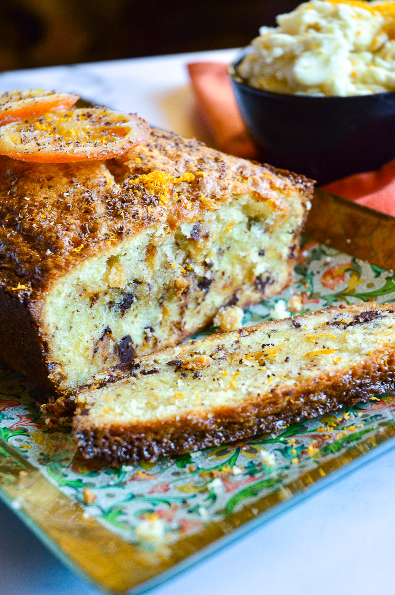 Chocolate Orange Pound Cake with bowl of frosting