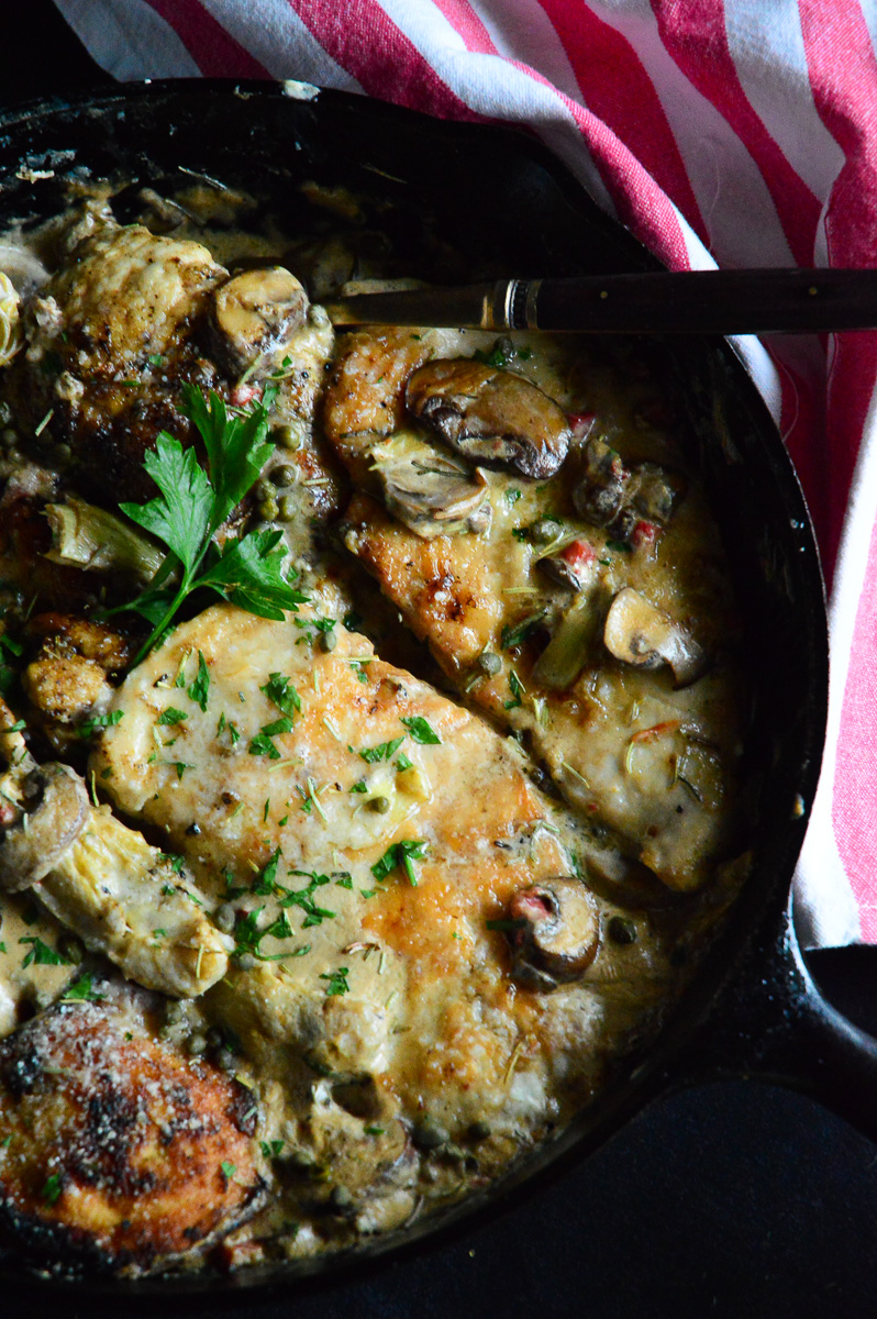 skillet chicken with artichokes and mushrooms in a creamy sauce