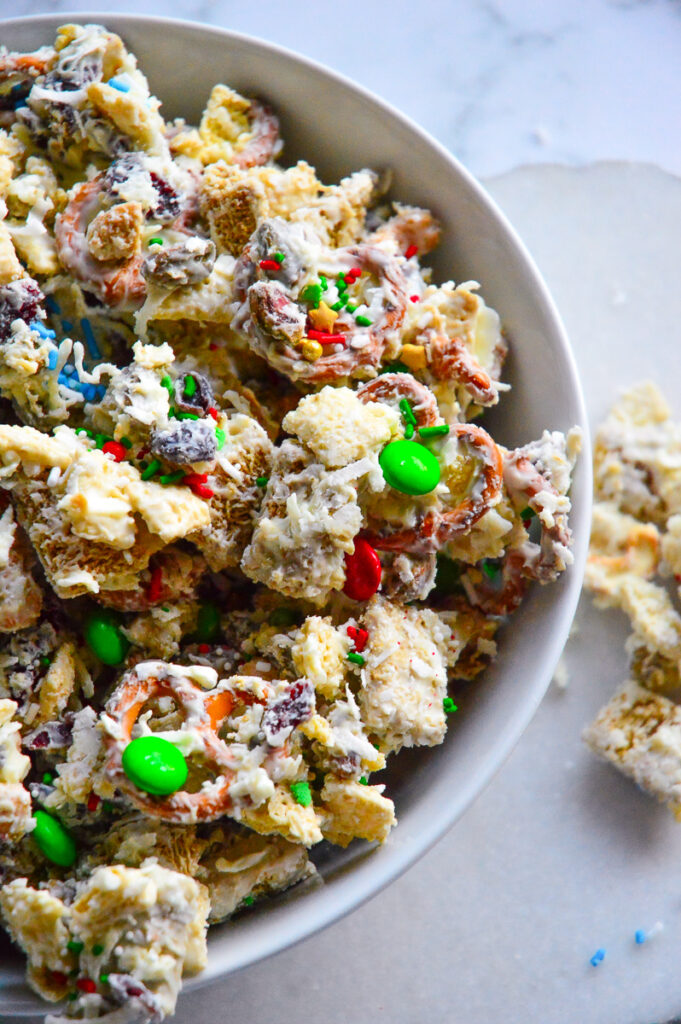 white trash recipe in white bowl with christmas sprinkle