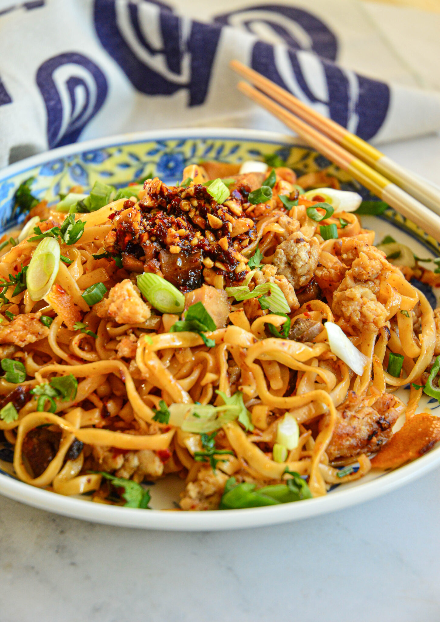 quick and easy spicy chili garlic noodles recipe with blue napkin