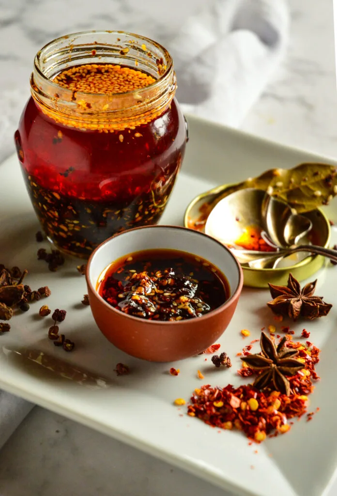 Chinese Chili garlic oil on white plate with spices