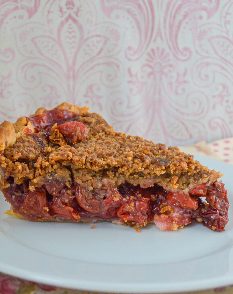 Slice of cherry pie with streusel topping