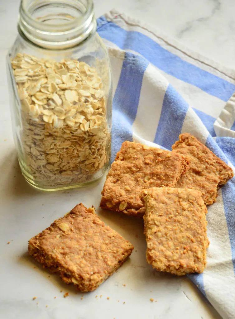 gluten free oatcakes recipe cut into square on blue striped napkin