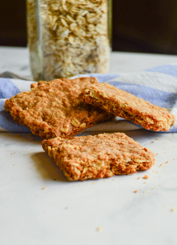 gluten free oatcakes recipe with jar of oats and blue napkin