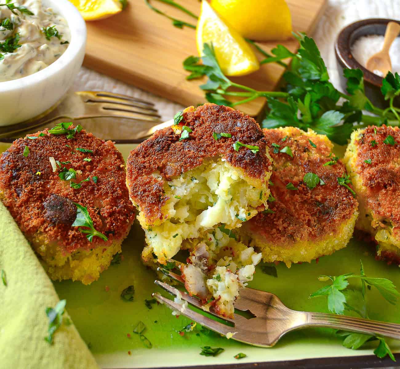 fish cakes with tender insides on green platter