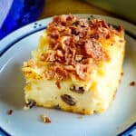 sweet noodle kugel recipe on blue rimmed plate