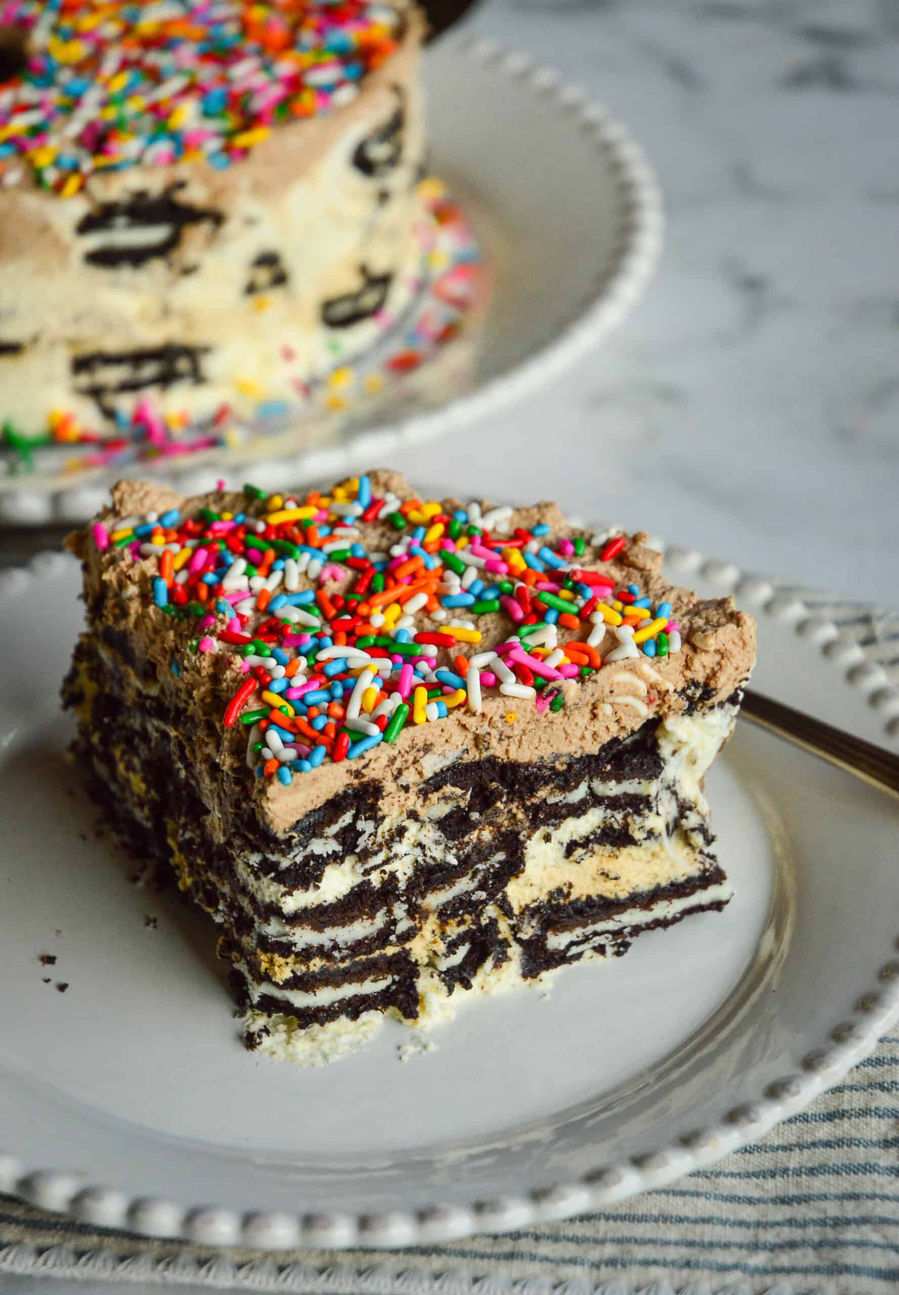 oreo chocolate wafer icebox cake recipe on white plate and striped napkin with fork