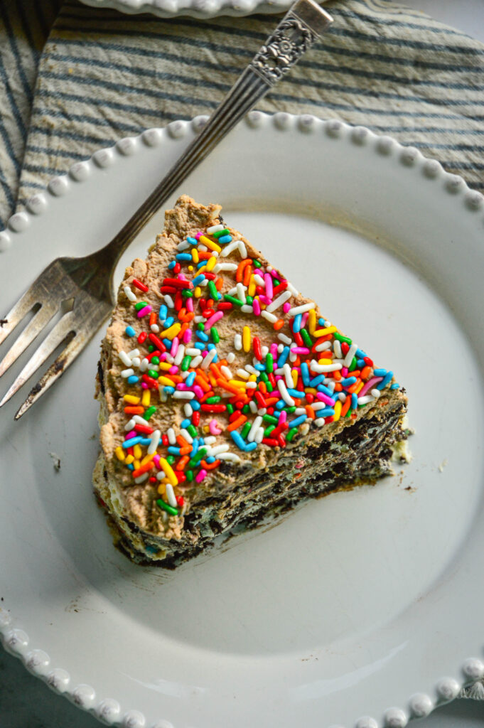 chocolate wafer icebox cake recipe on white plate and striped napkin with fork