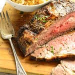 hot to cook a boneless rib roast on cutting board with serving fork