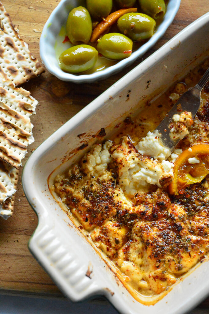 warm spicy feta dip recipes with honey and bowl of olives