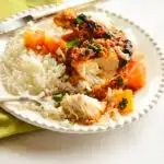 baked pineapple chicken on white plate with rice