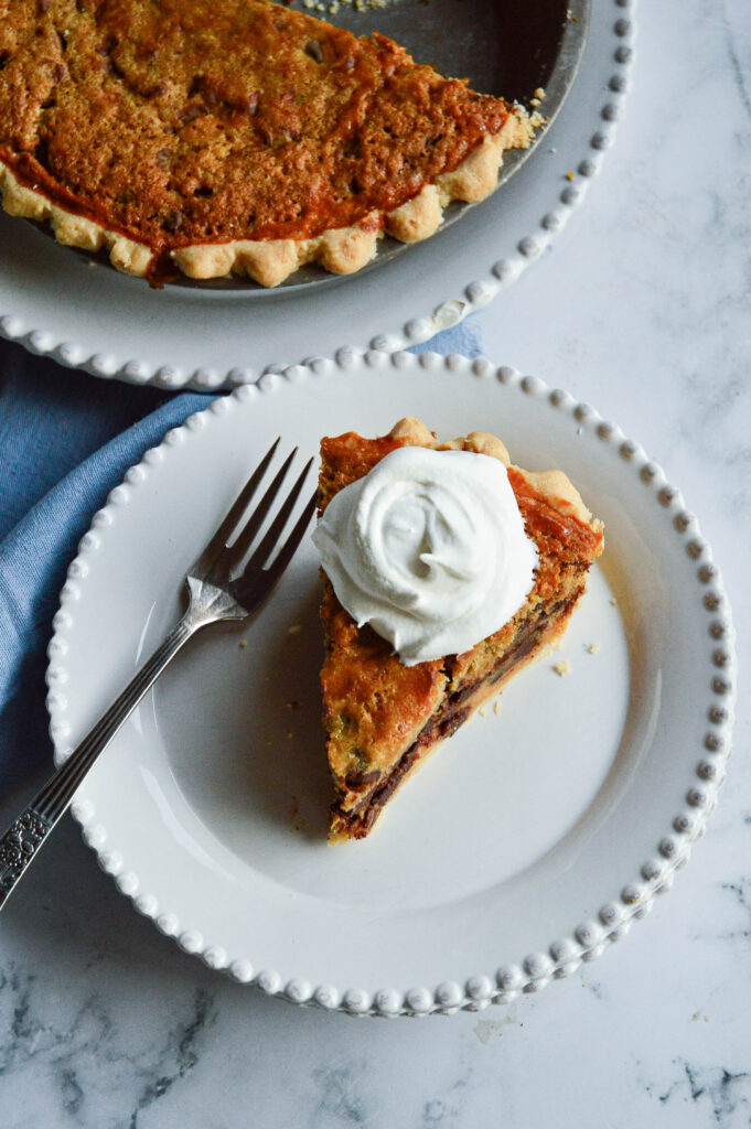 chocolate chip cookie pie recipe with slice on plate and in pie tin