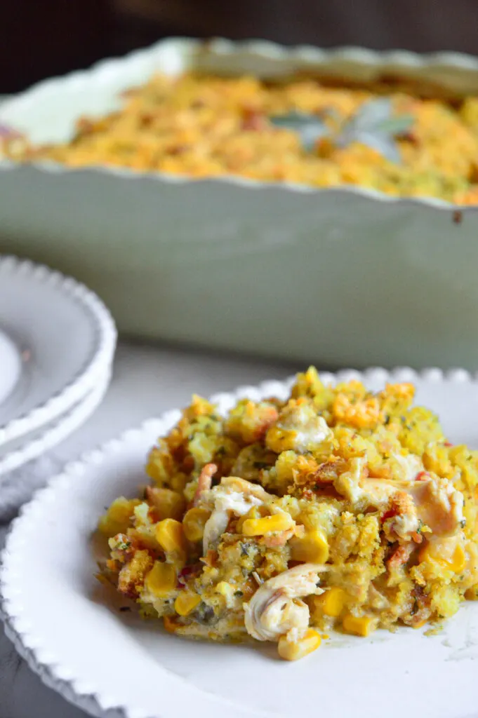 stove top stuffing chicken casserole recipe in casserole dish with serving on white plate