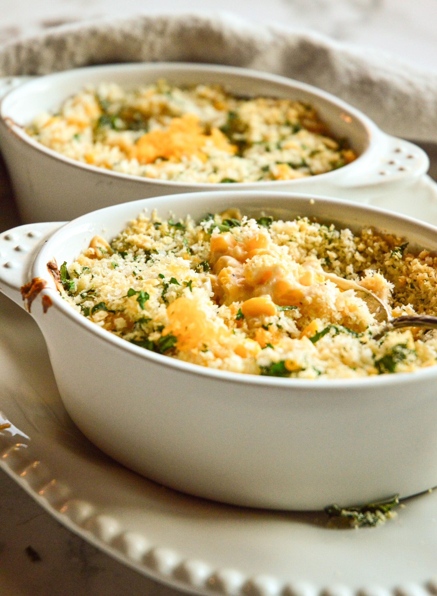 baked corn casserole for thanksgiving in white oval baking dished