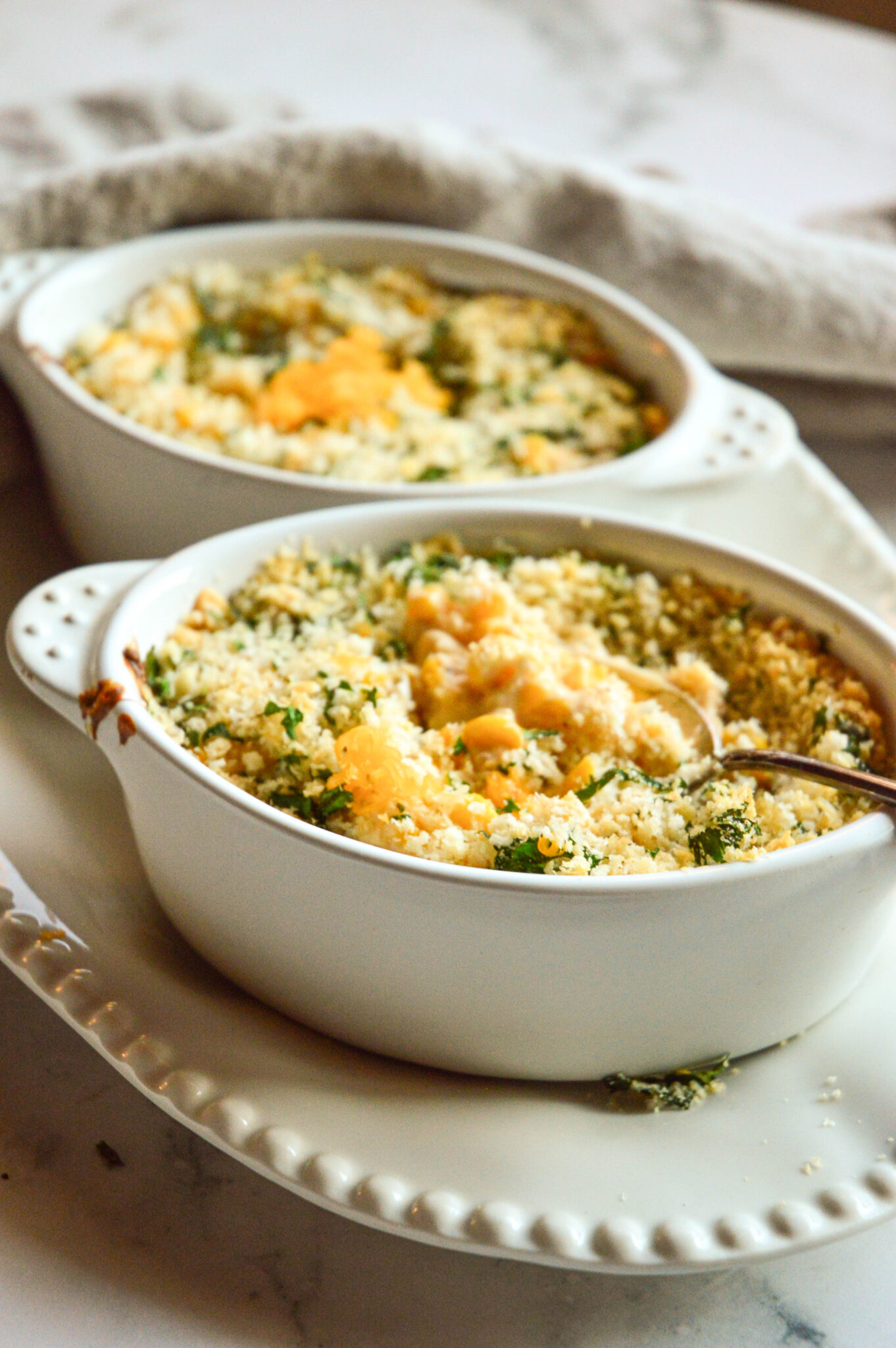 Baked corn recipes for Thanksgiving in white oval dishes