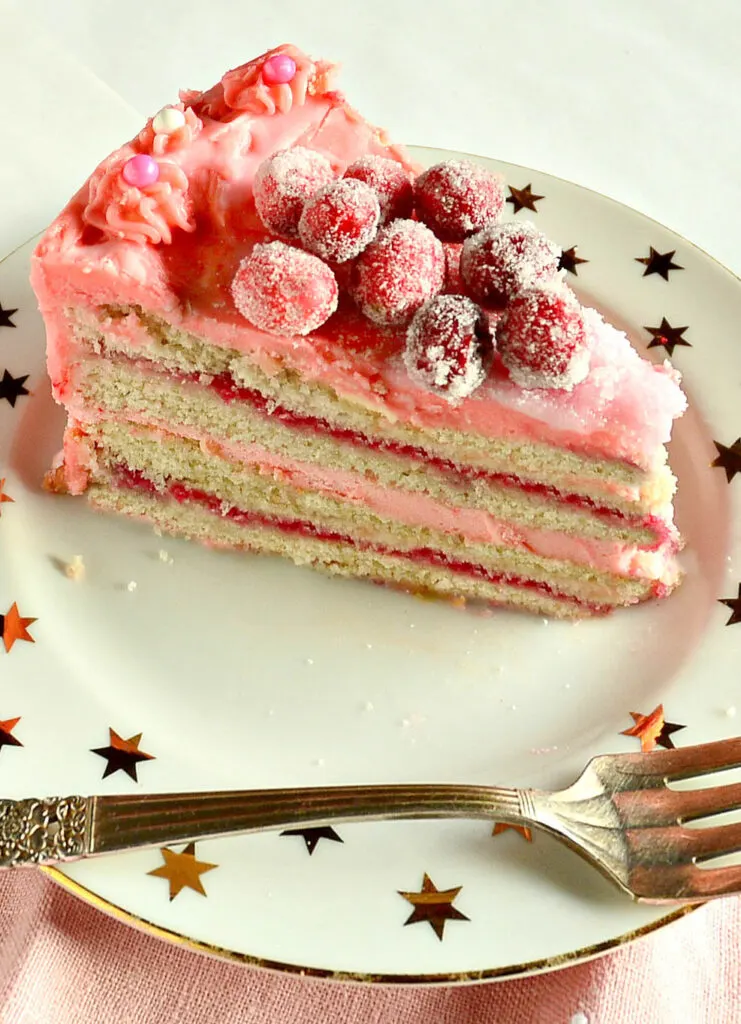 recipe for white chocolate icing on cranberry filled white cake on star designed plate