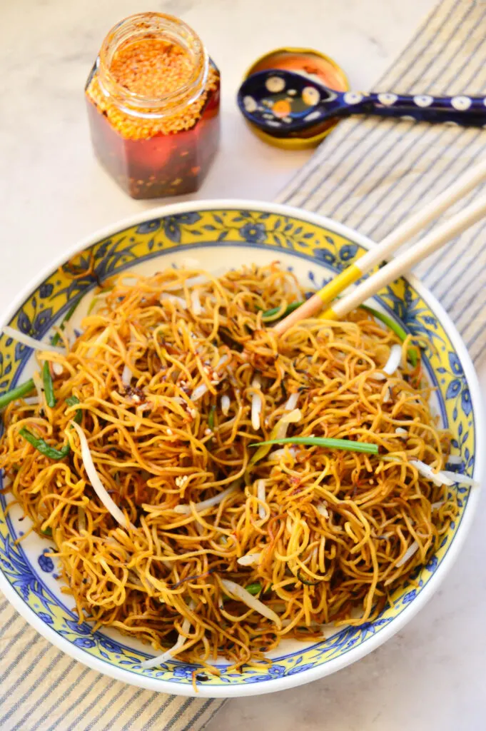 bowl of chow mien noodles with chili oil