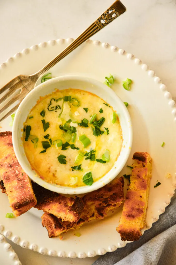 baked eggs en cocotte in ramekin with fork