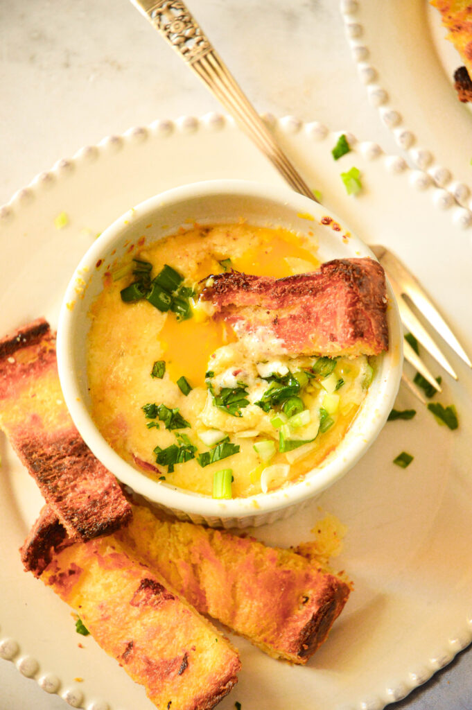 baked eggs en cocotte in ramekins with toast strips