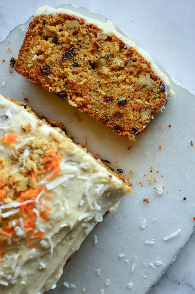 carrot loaf cake recipe sliced on marble board
