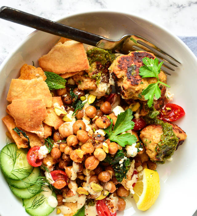 sauteed spinach and chickpeas pita salad in white salad bowl