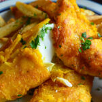 fried cod fish recipes on plate.