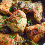 garlic braised chicken thighs in cast iron skillet