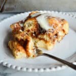 cinnamon roll focaccia with fork on white plate