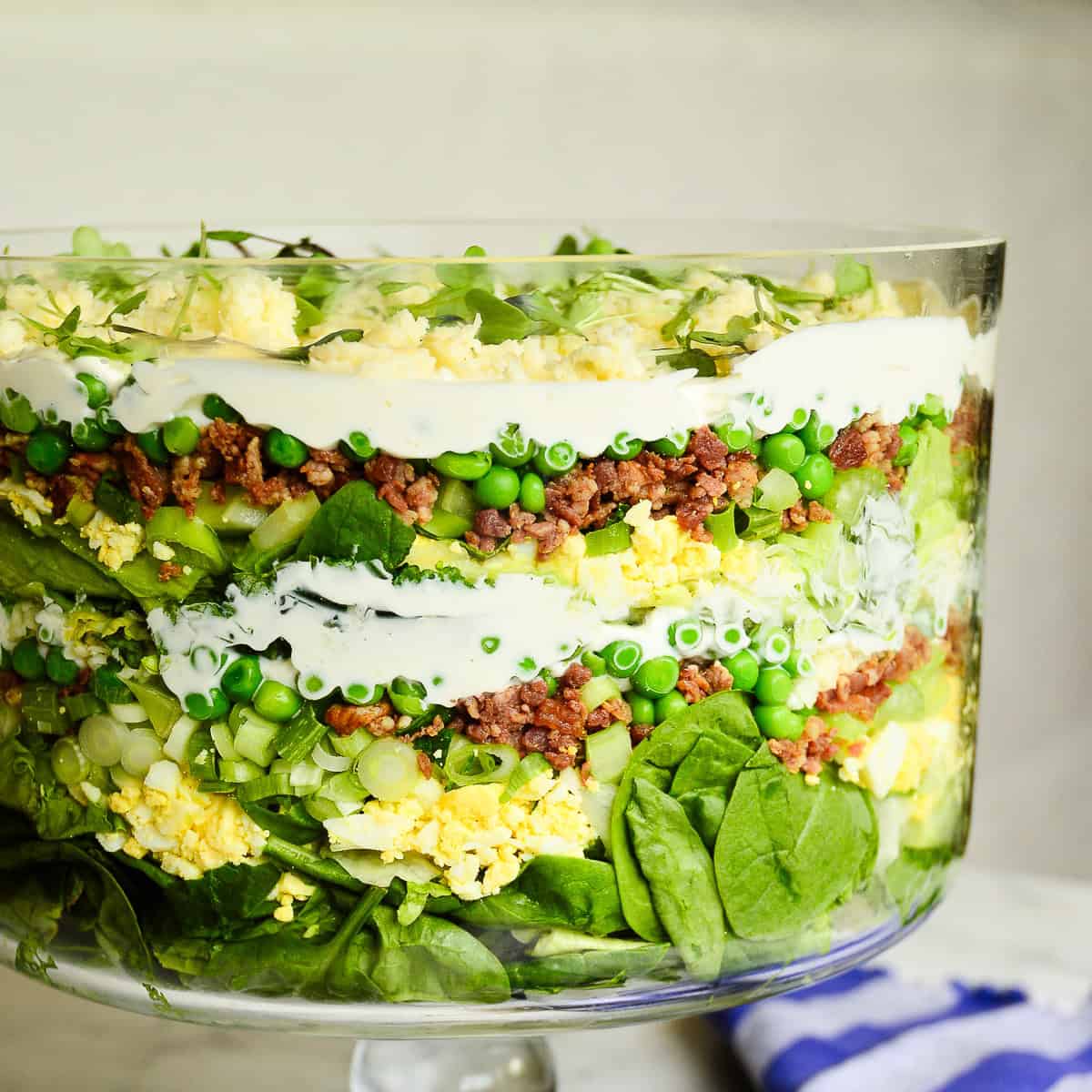 layeredd salad recipe in glass trifle bowl