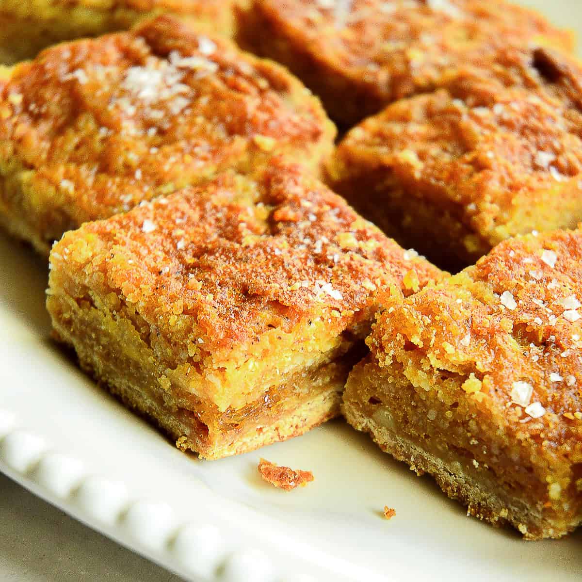 close up of salted honey bars on white plate