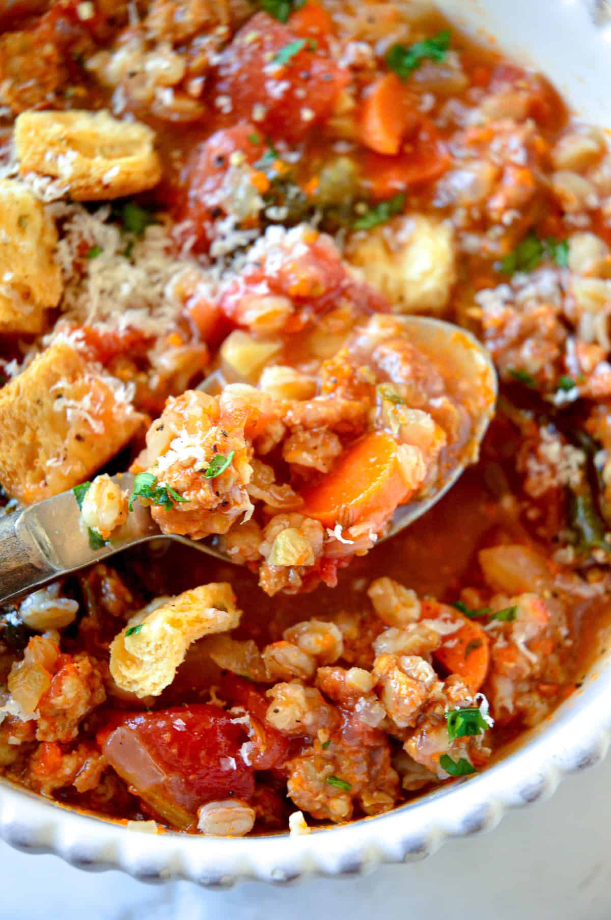 close up of soup with spoon of soup