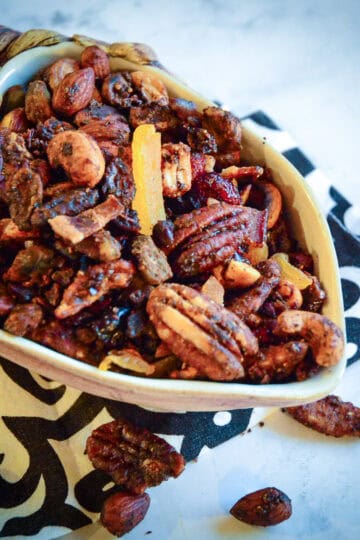 snack mix recipe in fall bowl on black and white napkin