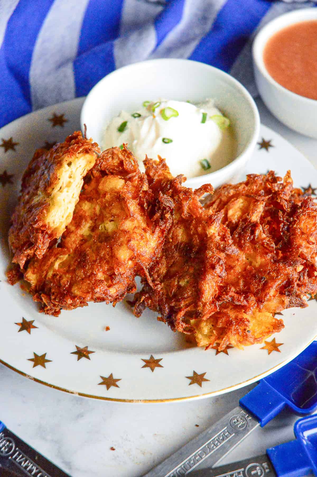 latkes on serving plate with sour cream