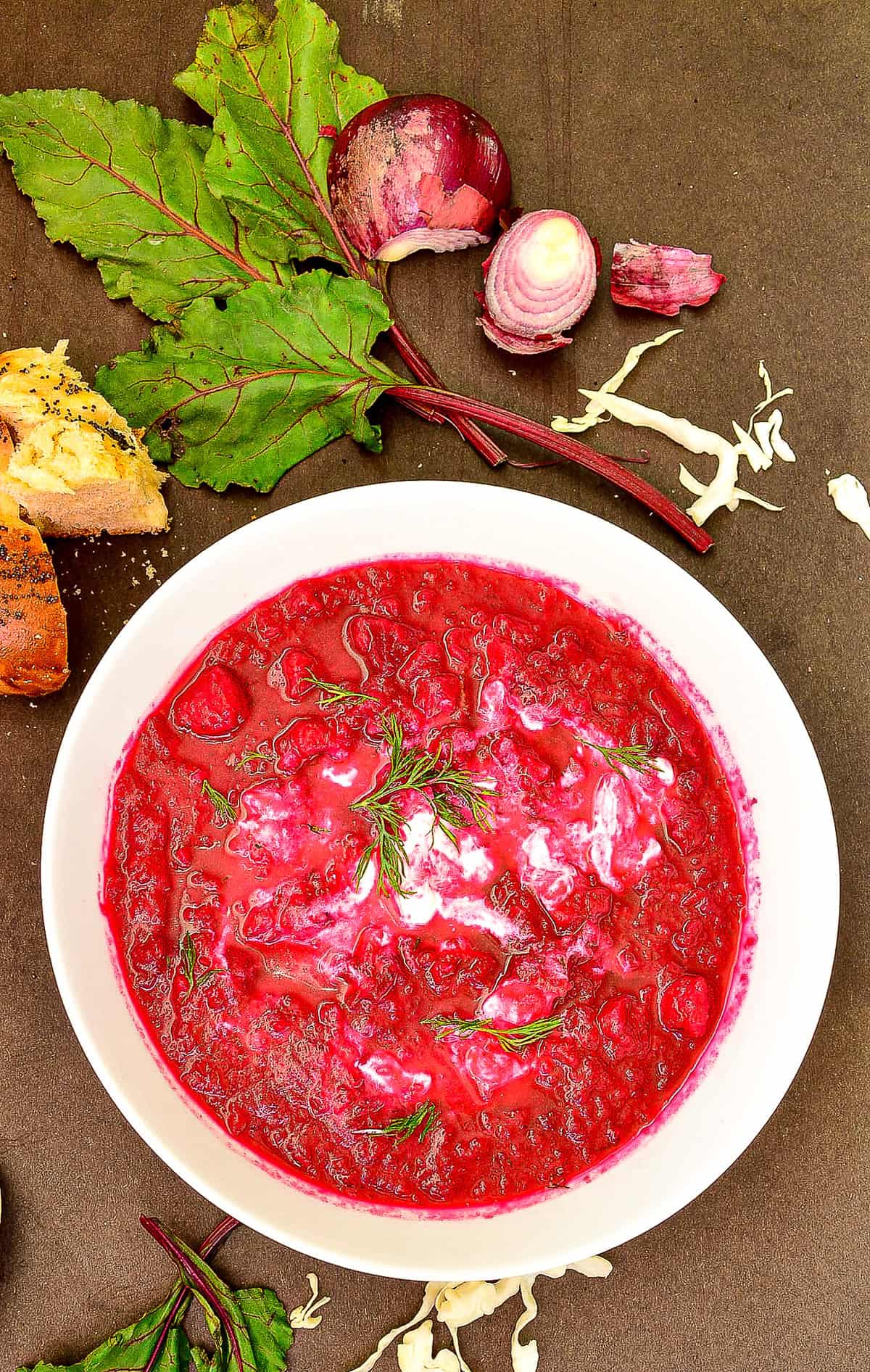 hot beet borscht in white bowl
