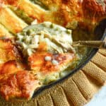 spoonful of chicken pot pie with puff pastry in skillet