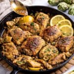 lemon chicken with artichoke hearts recipe in cast iron skillet