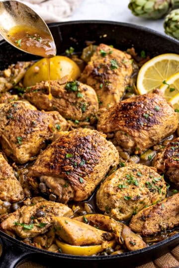 lemon chicken with artichoke hearts recipe in cast iron skillet