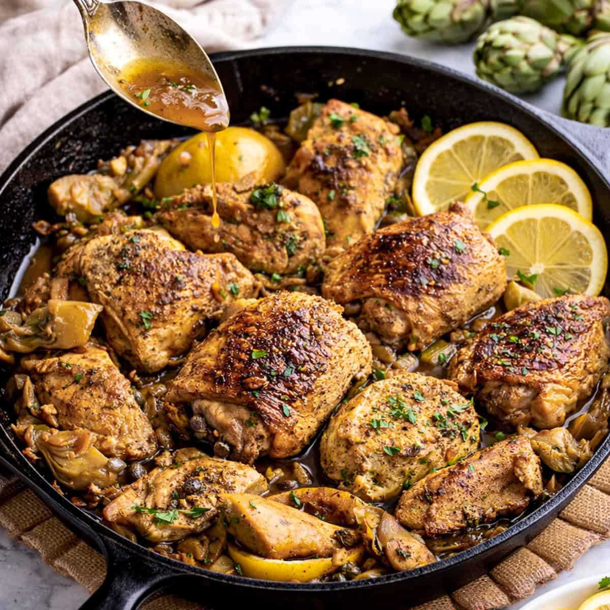 lemon chicken with artichoke hearts recipe in cast iron skillet