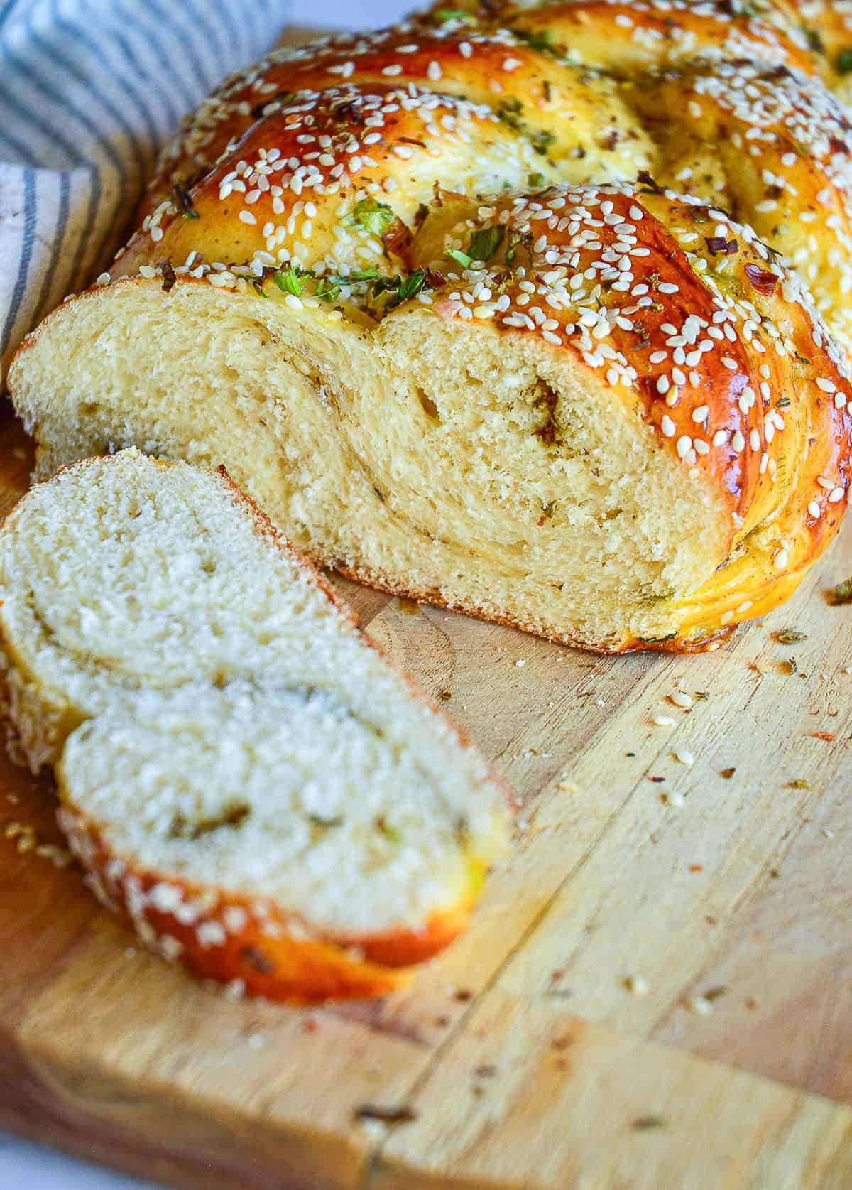 close up of challah with scallions sliced open